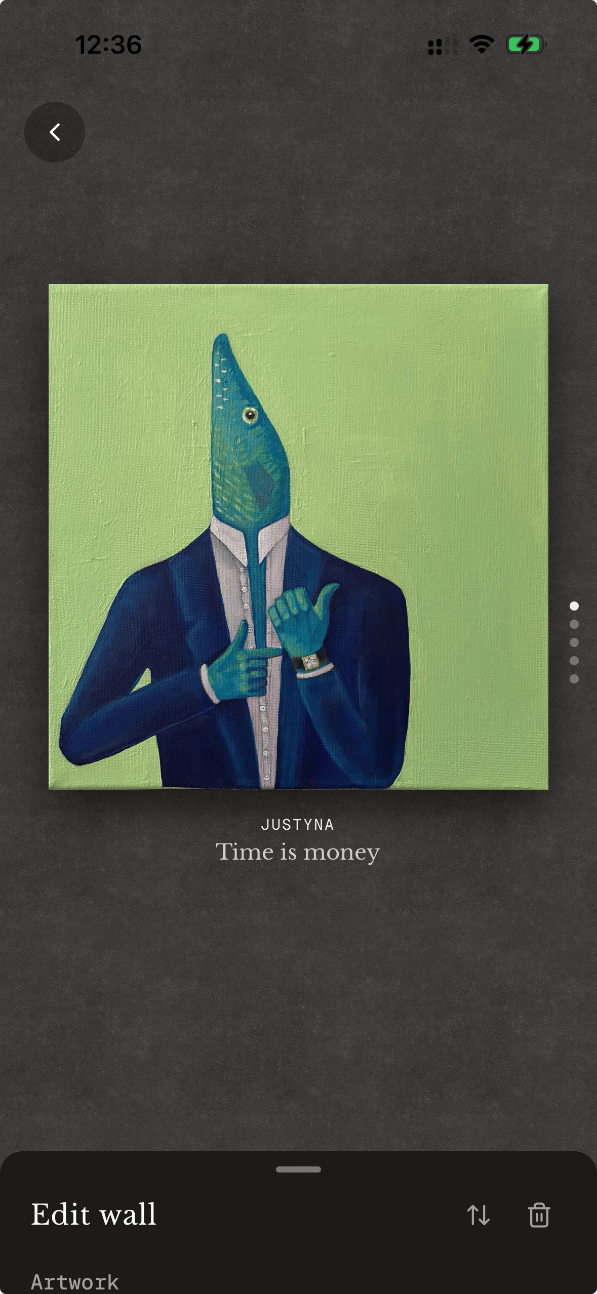 Artwork wall with caption and artist name visible